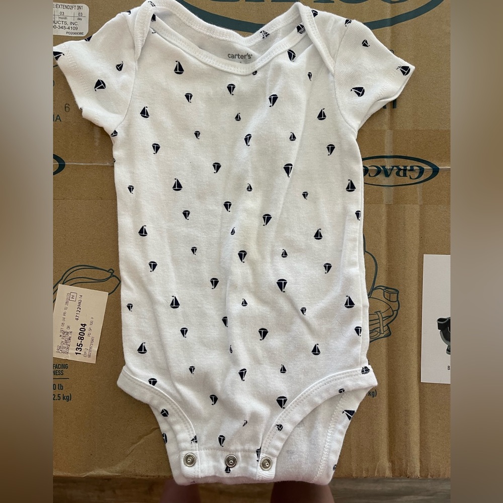 Three nautical onesies